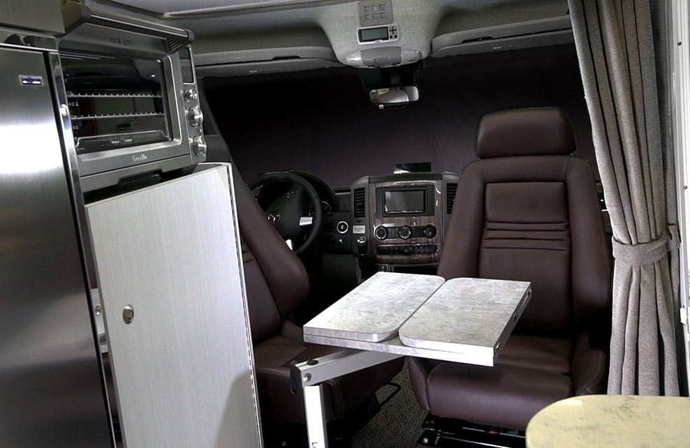 Swiveled-front-seat-with-table Van